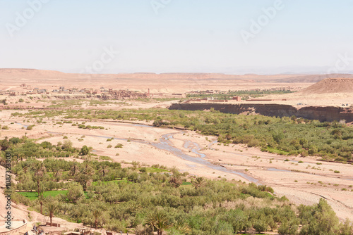 Desert River Landscape with Distant Mountains