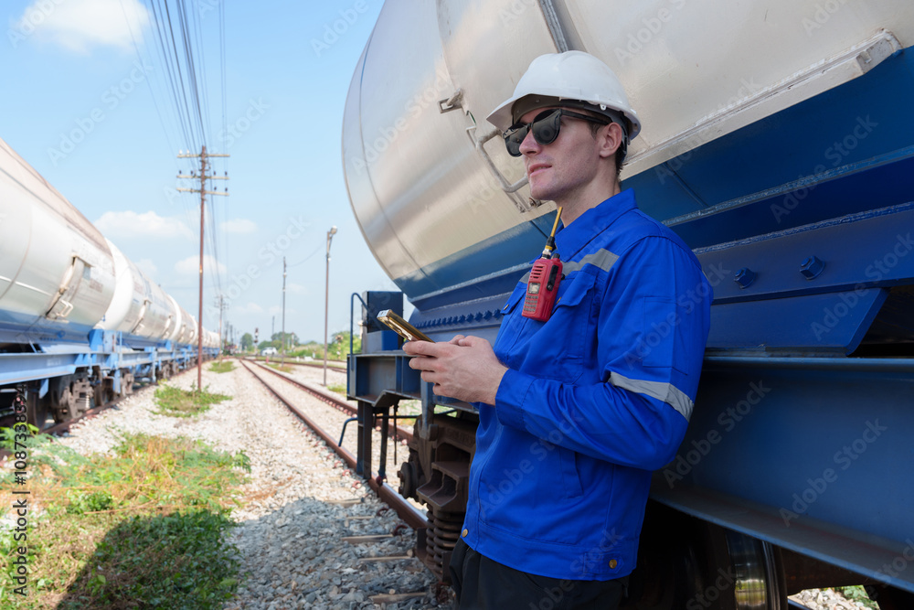 Male engineer checking the readiness of gas-powered train Male engineer checking the readiness of gas-powered train