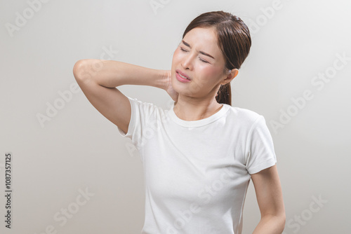 Pain body muscles stiff problem, asian young woman, girl painful with neck pain body ache from work, holding massaging rubbing shoulder hurt, sore on white background. Health care and medicine concept