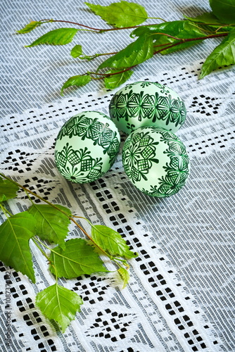 Easter, spring holiday - beautiful colorful Easter eggs - Czech tradition of decorating with wax, classic still life with Easter eggs and spring flowers,