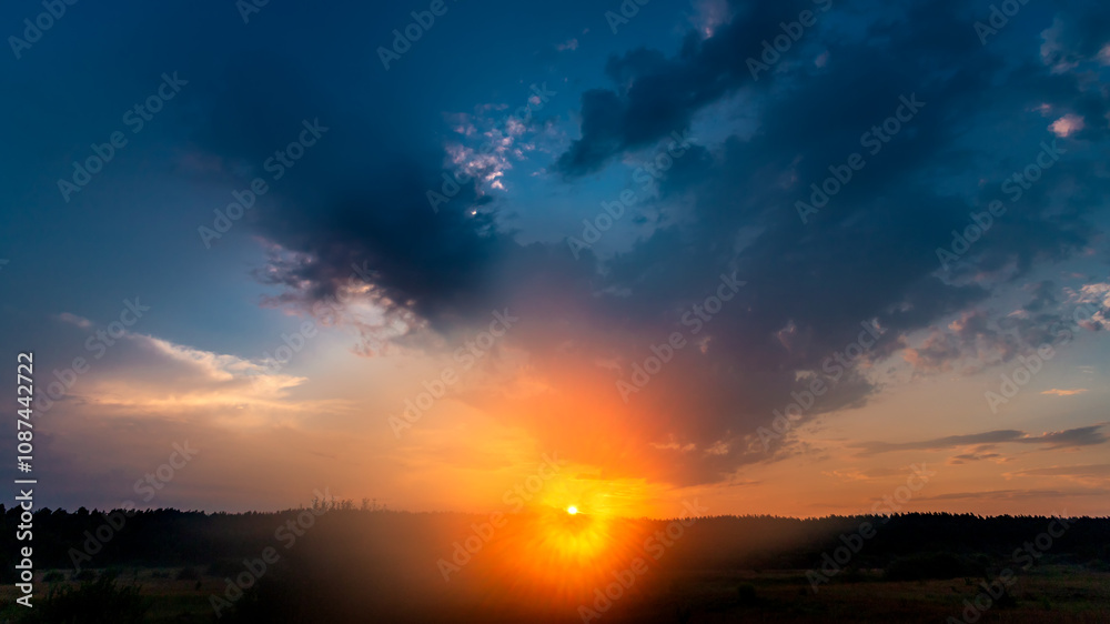Real majestic sunrise sundown sky background with gentle colorful clouds without birds over forest. Real majestic sunrise sundown sky background with gentle colorful clouds without birds over forest.