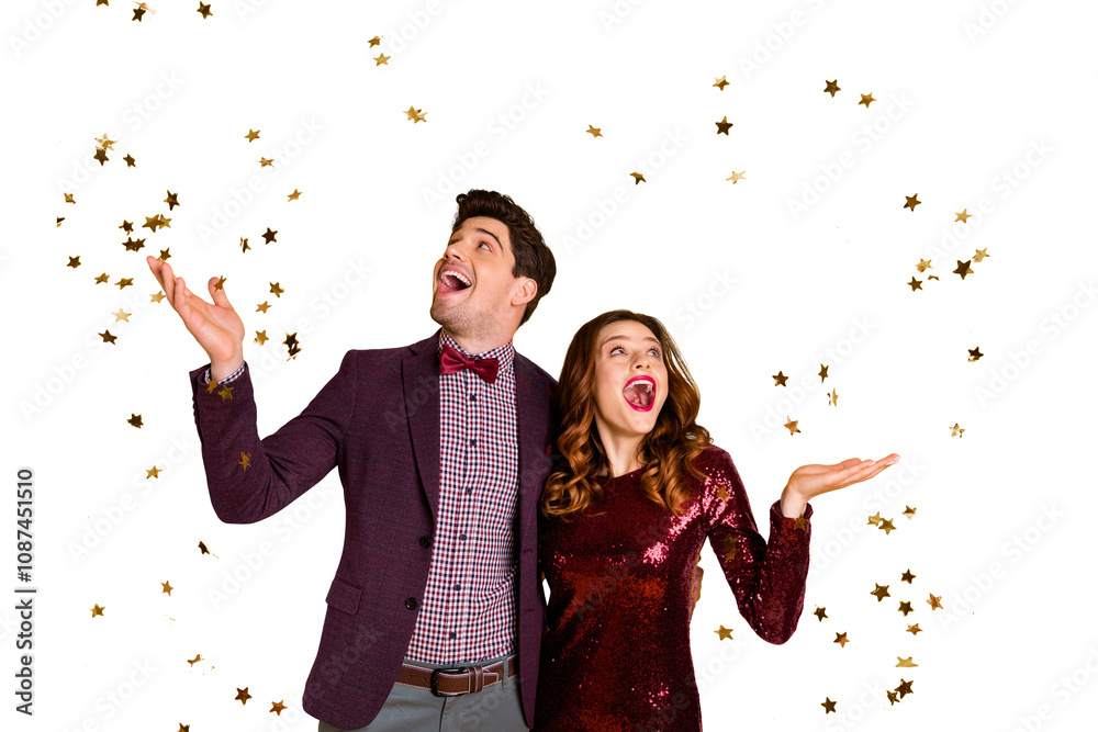 Portrait of impressed millennial raise hands meeting see confetti scream shout dress suit tux tuxedo wavy curly hairdo isolated over yellow background Portrait of impressed millennial raise hands meeting see confetti scream shout dress suit tux tuxedo wavy curly hairdo isolated over yellow background