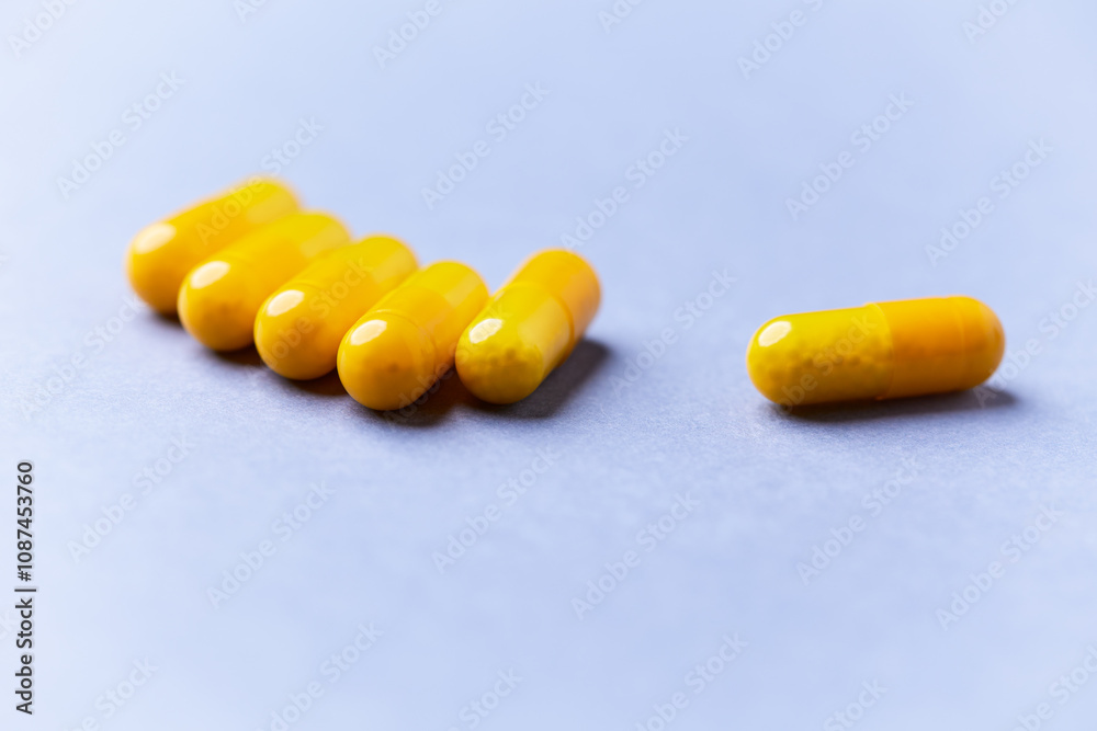 Vitamin C capsules. Bright background. Close up. Copy space.