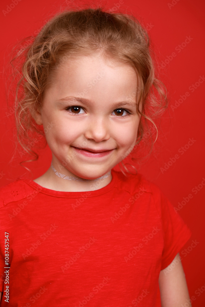 Close up little girl, isolated on red background studio Close up little girl, isolated on red background studio