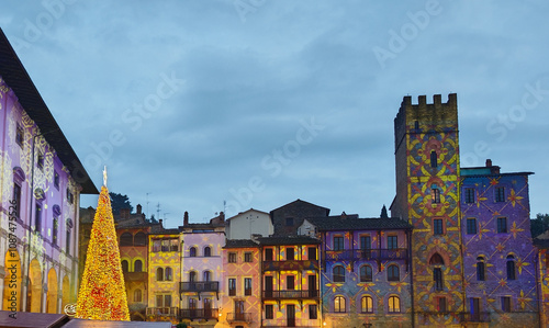 A shining christmas tree in the main square Piazza del Popolo of Arezzo in Tuscany, Italy