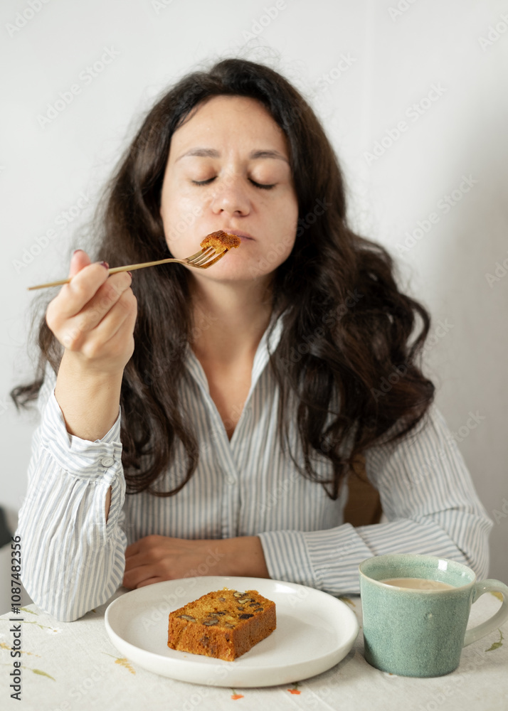 Woman Eating Cupcake with Selective Focus Woman Eating Cupcake with Selective Focus