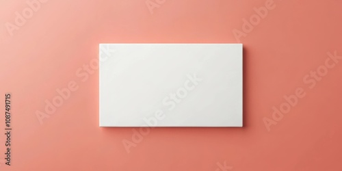 A blank white square canvas against a coral backdrop, showcasing simplicity and potential for creative expression.