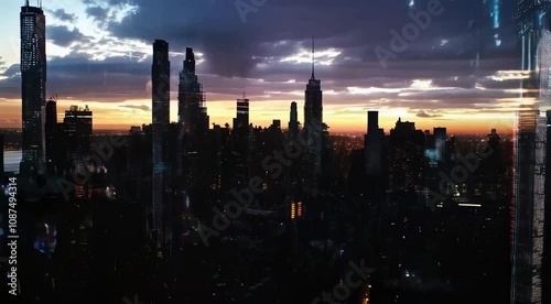 Stunning sunset over New York City skyline with digital overlays showcasing urban life and technology