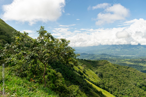 Beautiful natural landscape of the Poblanco river in southwestern Antioquia, Colombia with mountains in the background aerial view.