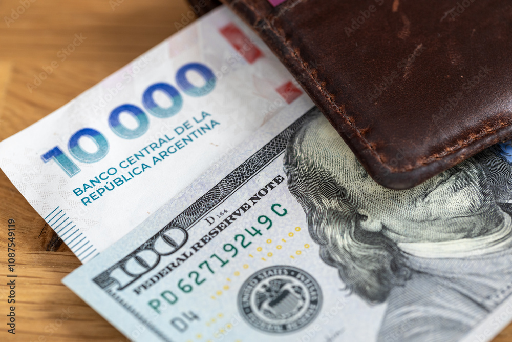 Money Argentine, peso vs dollar. Financial concept. Exchange peso to dollars. New 10,000 thousand Argentine pesos and 100 US dollars in wallet. Close up