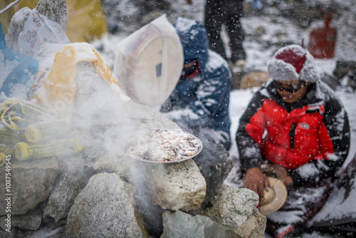Incense burning on a stone altar during a sacred puja ceremony in Everest Base Camp, Nepal.