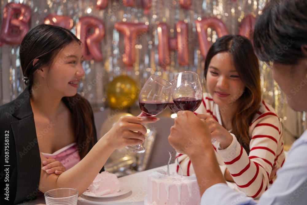 Happy friends with tasty cake and glasses of sparkling wine celebrating birthday indoors Happy friends with tasty cake and glasses of sparkling wine celebrating birthday indoors