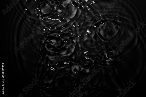 Image of black water surface with waves.