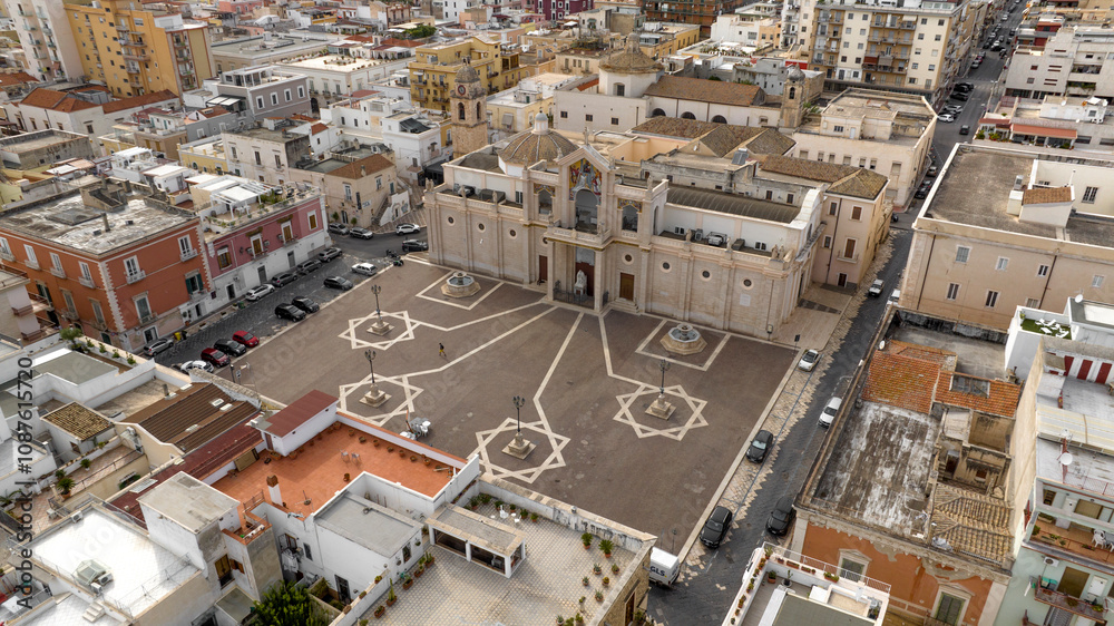 Fototapeta premium Aerial view of Manfredonia Cathedral. It is a Roman Catholic cathedral located in the historic center of the town in the province of Foggia, Puglia, Italy. It is dedicated to Saint Laurence of Siponto