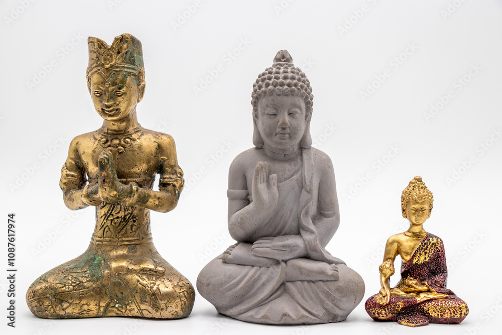 Trio of Sacred Statues: Golden Prayer Figurine, Stone Buddha, and Ornate Golden Buddha in a Harmonious Display Trio of Sacred Statues: Golden Prayer Figurine, Stone Buddha, and Ornate Golden Buddha in a Harmonious Display