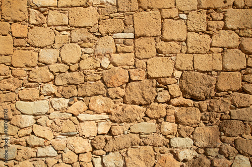 Old light stone wall close up