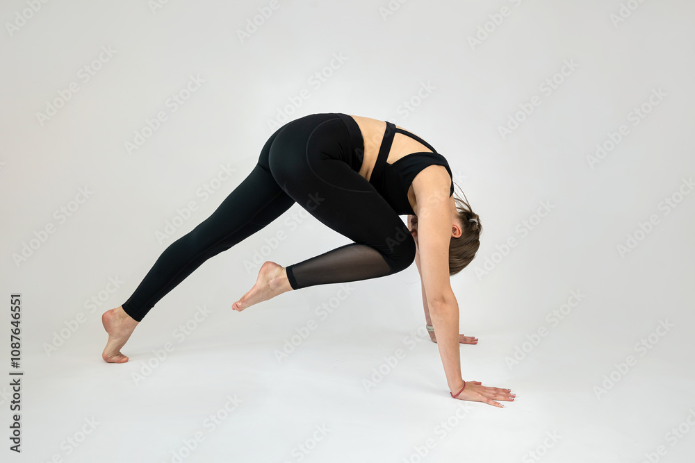 Pretty caucasian young woman doing stretching workout isolated on white background Pretty caucasian young woman doing stretching workout isolated on white background