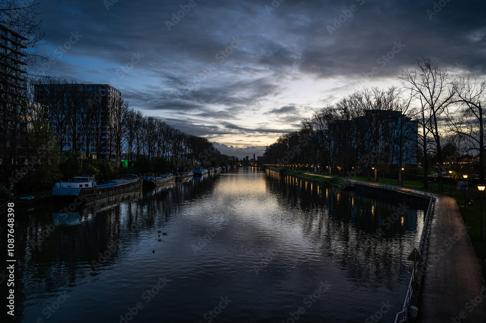Houseboats at the Biestebroeck quai during sunset in Anderlecht, Brussels Capital Region, Belgium Houseboats at the Biestebroeck quai during sunset in Anderlecht, Brussels Capital Region, Belgium