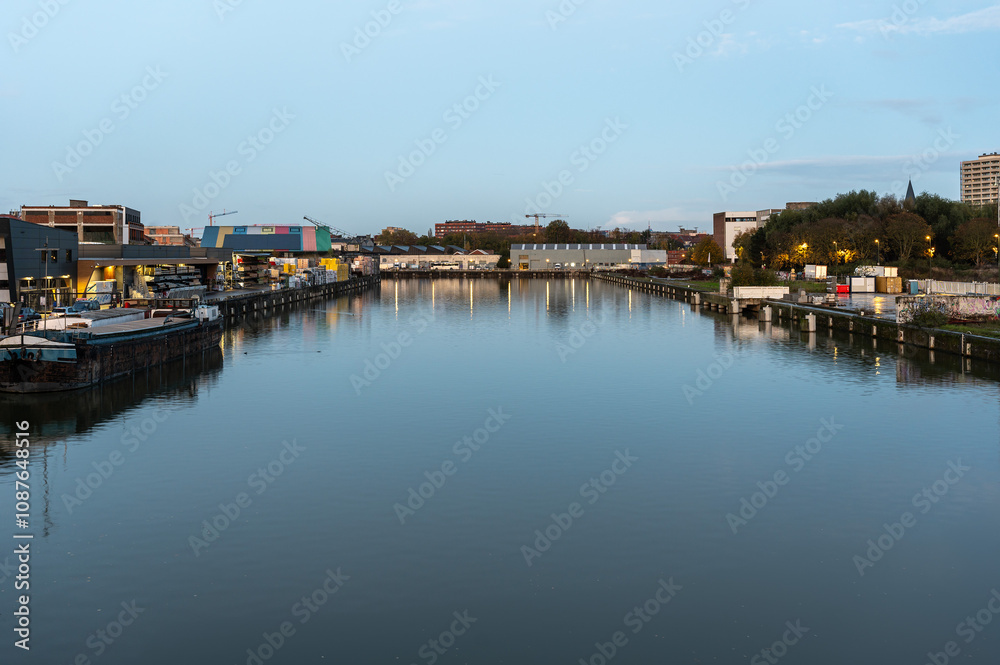 Water reflections in the industrial zone of the Quai du Canal an Boestebroeck in Anderlecht, Brussels Capital Region, Belgium Water reflections in the industrial zone of the Quai du Canal an Boestebroeck in Anderlecht, Brussels Capital Region, Belgium