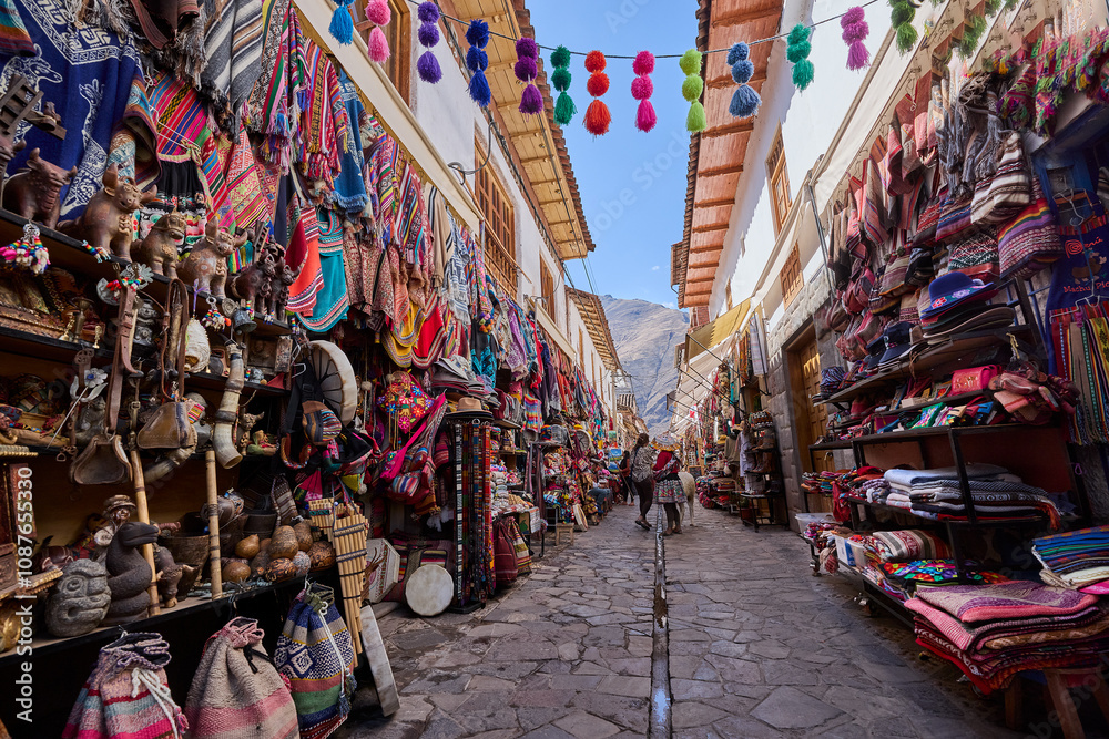Obraz premium Pisac Market is one of the most vibrant and famous markets in the Sacred Valley of Peru, drawing visitors from around the world. It is a colorful hub of traditional Andean culture.