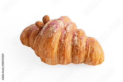 Close up croissant with almonds and pink sprinkles , isolated on white background