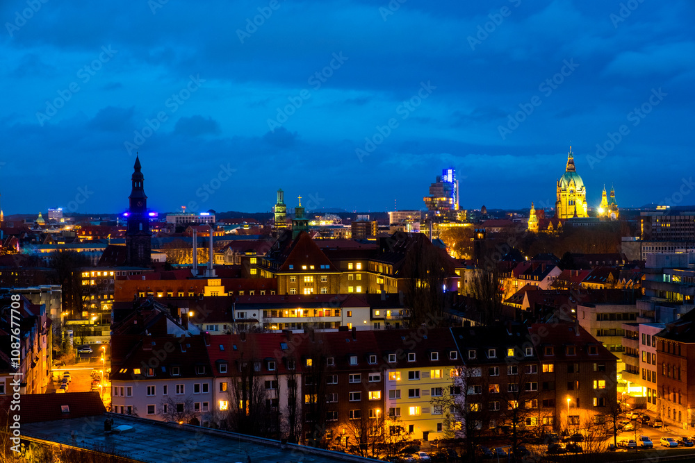 Obraz premium Hanover, Germany. Aerial view of Hanover, Germany skyline during the cloudy sunset. Time-lapse of historical landmarks in the city, panning video 