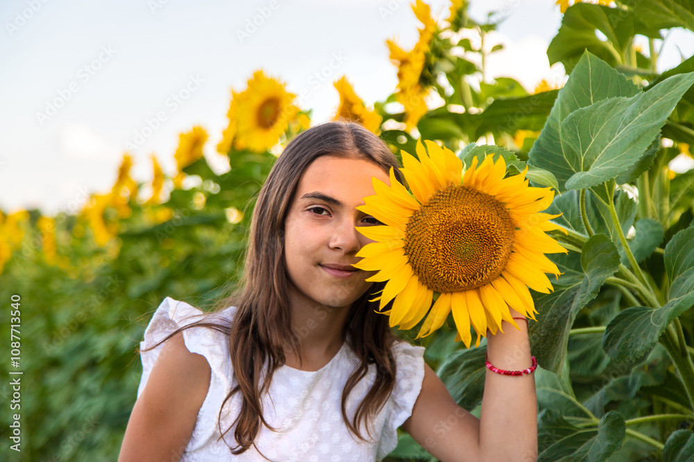 Child in a field of sunflowers. Selective focus. Child in a field of sunflowers. Selective focus.