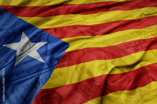 Photography waving colorful flag of catalonia on the dollar money background