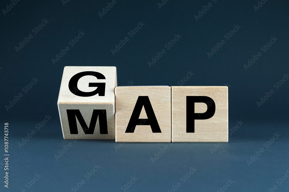Obraz premium Wooden blocks spelling GAP and MAP