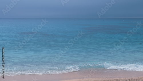 Soft turquoise wave on the coast, Cala Goloritz beach, Mediterranean sea. photo