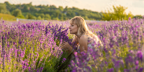 Woman in a lavender field. Selective focus.