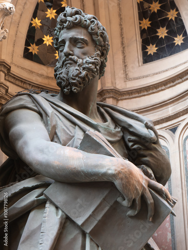 The statue of Saint Luke 1597-1602 by Giambologna in the external niches of the church of Orsanmichele in Florence, Italy. photo