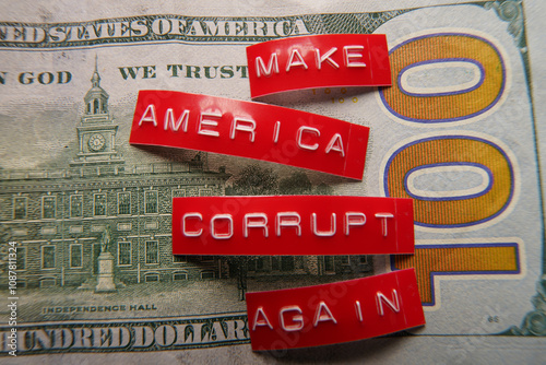Make America Corrupt Again red labels on hundred dollar bill
