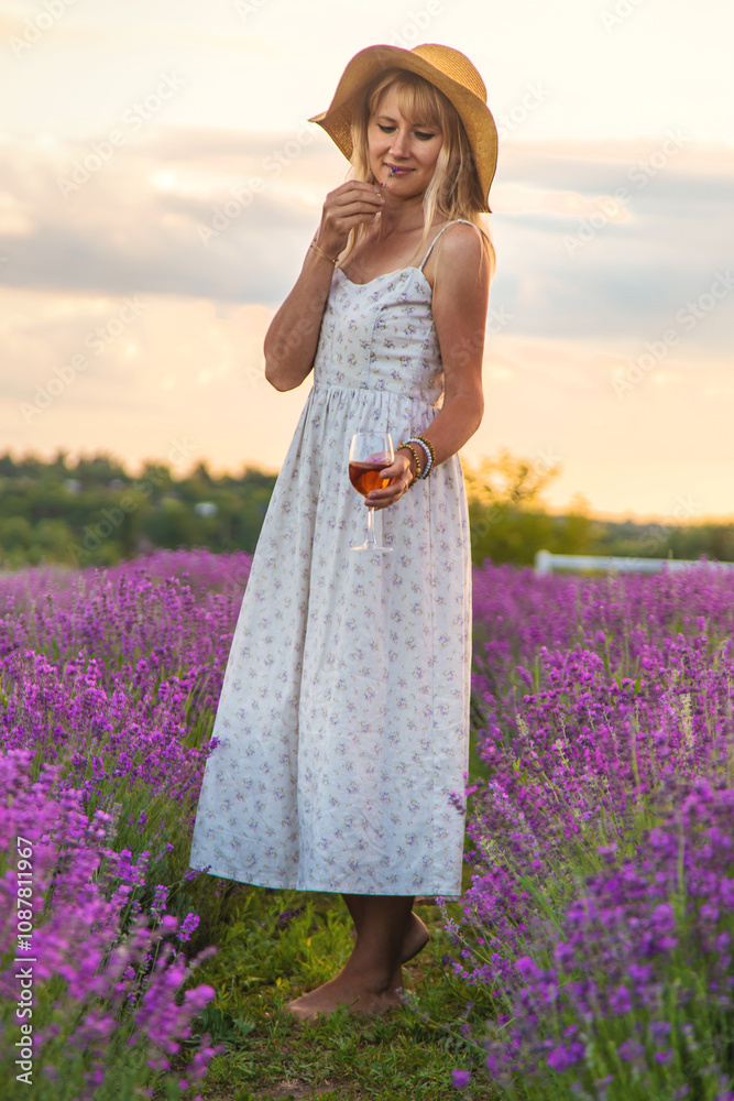 Woman with wine in lavender field wine. Selective focus. Woman with wine in lavender field wine. Selective focus.