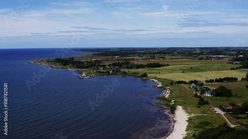 Wallpaper Mural Green coastline by a blue sea in summertime Torontodigital.ca