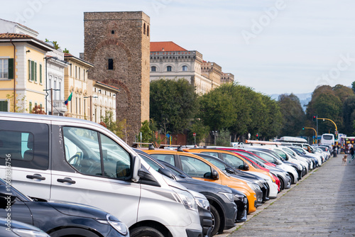 Florence, Italy - November 5, 2024: Florence cityscape. Parking for cars. Many parked cars, problems with parking photo