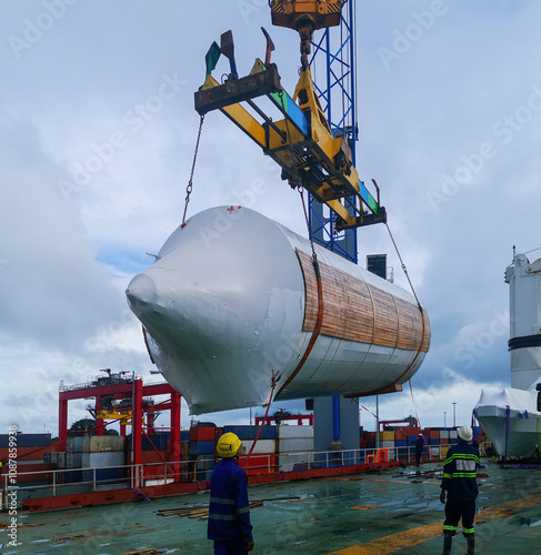 detail of big brewery tank discharged from a big roro vessel in conakry , west africa photo