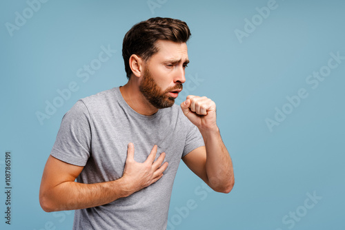 Fotografie Portrait of sick, upset Hispanic man cough, having virus, cold