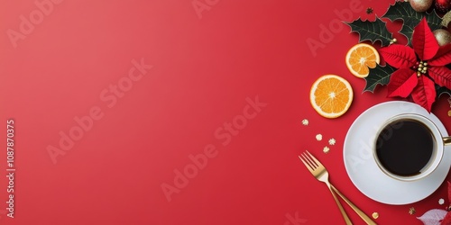 Festive holiday table setting with a red background, coffee, and seasonal dec...