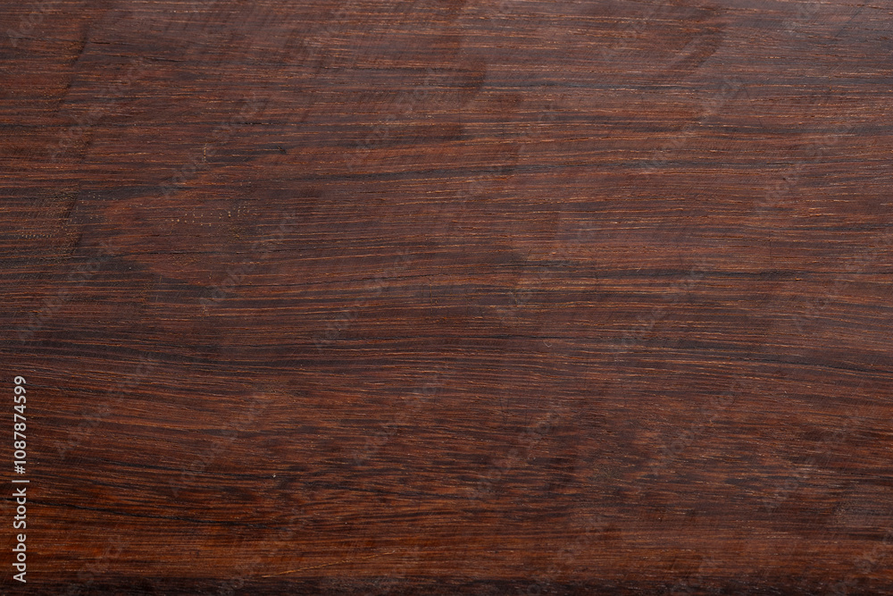 You can see in the image a dark wooden surface, you can see the delicate grains of the wood You can see in the image a dark wooden surface, you can see the delicate grains of the wood
