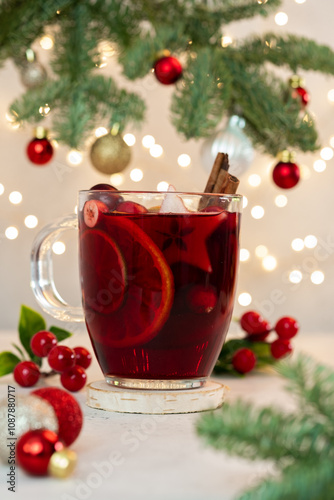 A mug of red drink with a star on it