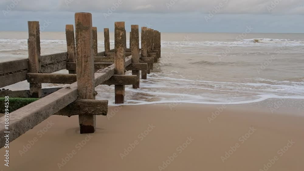 Close up of wooden groynes on the Norfolk coast Close up of wooden groynes on the Norfolk coast