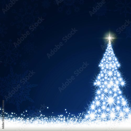 Christmas tree isolated on blue night background.