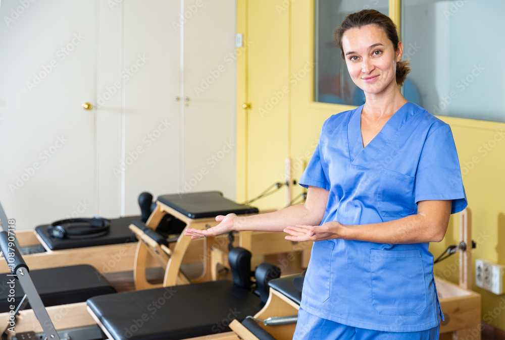 Portrait of benevolent female healthcare professional in the recovery and pilates room Portrait of benevolent female healthcare professional in the recovery and pilates room