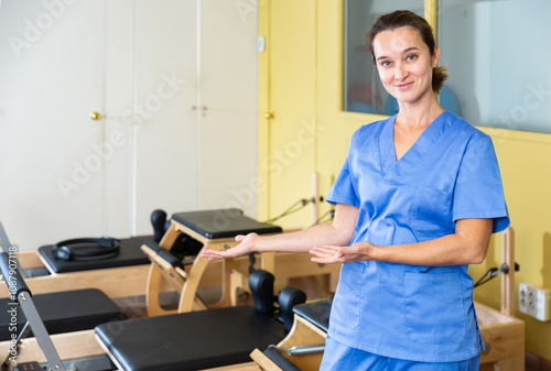 Portrait of benevolent female healthcare professional in the recovery and pilates room photo