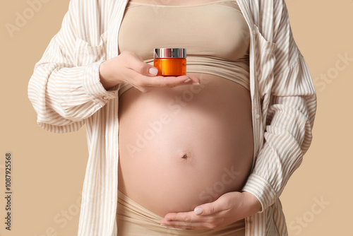 Pregnant woman holding skin...