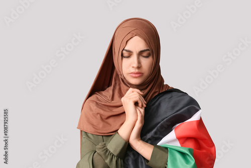 Young Muslim woman with Pal...