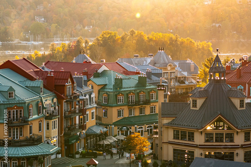 Mont-Tremblant, Quebec, Canada - October 03, 2023: House roofs surrounded by autumnal maple trees
