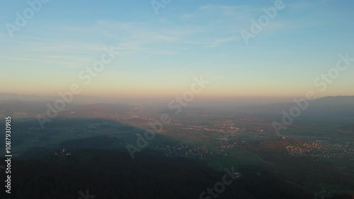 Flying towards the Ljubljana from Vrhnika, Slovenia, in autumn and foggy conditions, aerial shot, drone video photo