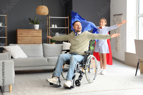 Happy man in wheelchair and...